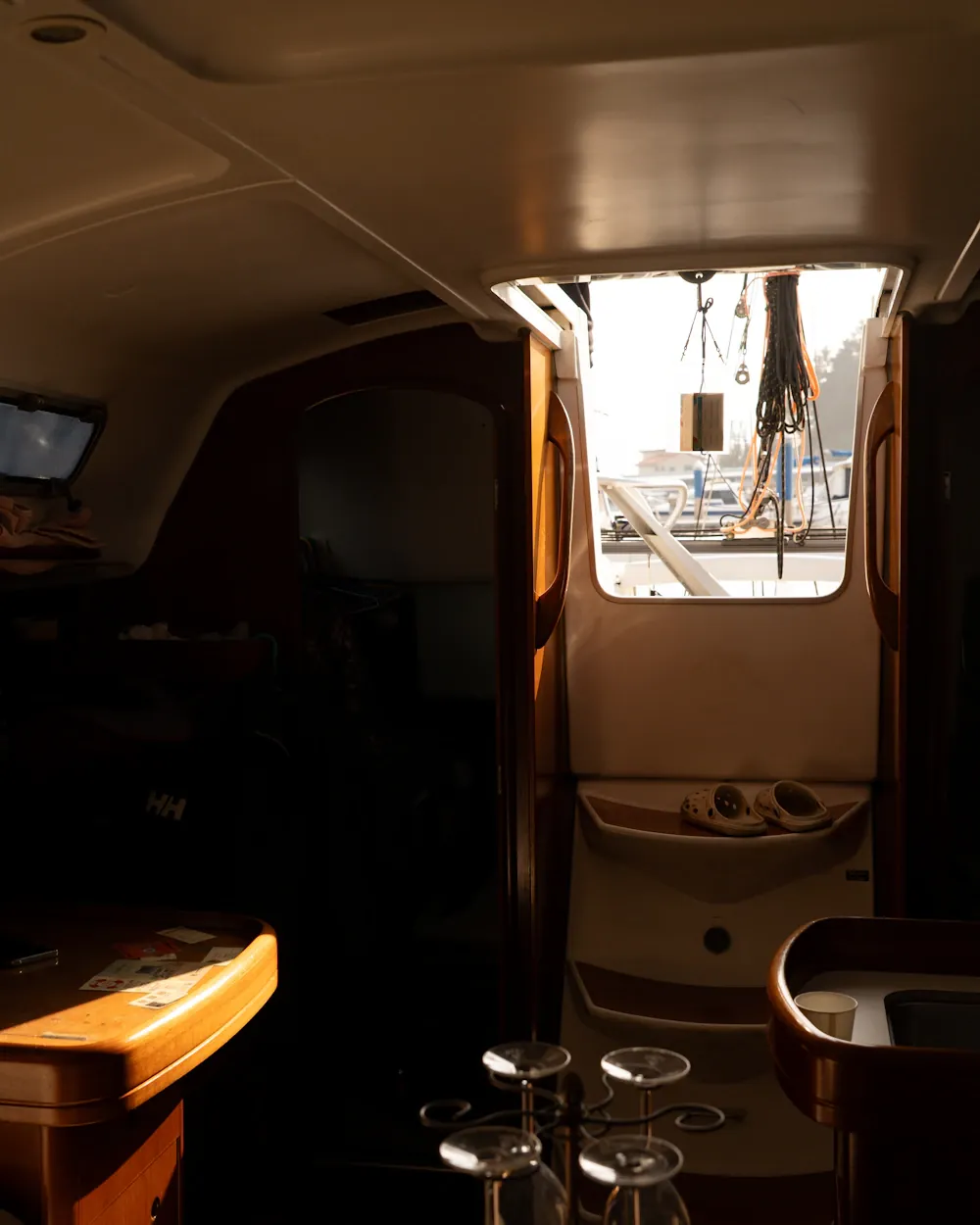 Dark timber boat interior looking out to the deck