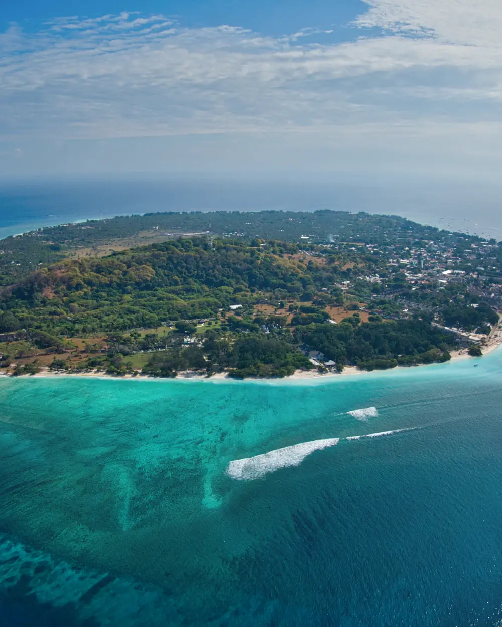 Aerial view of Gili Trawangan ringed by shallow turquoise reef