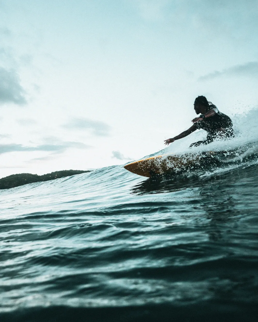 Surfer riding a clean wave