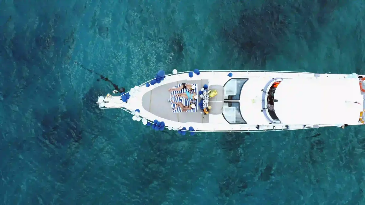 Charter boat under way on open blue water