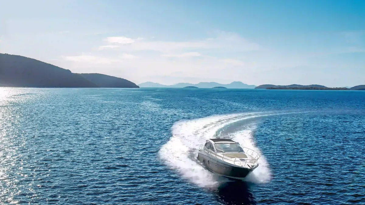 Charter boat under way on open blue water