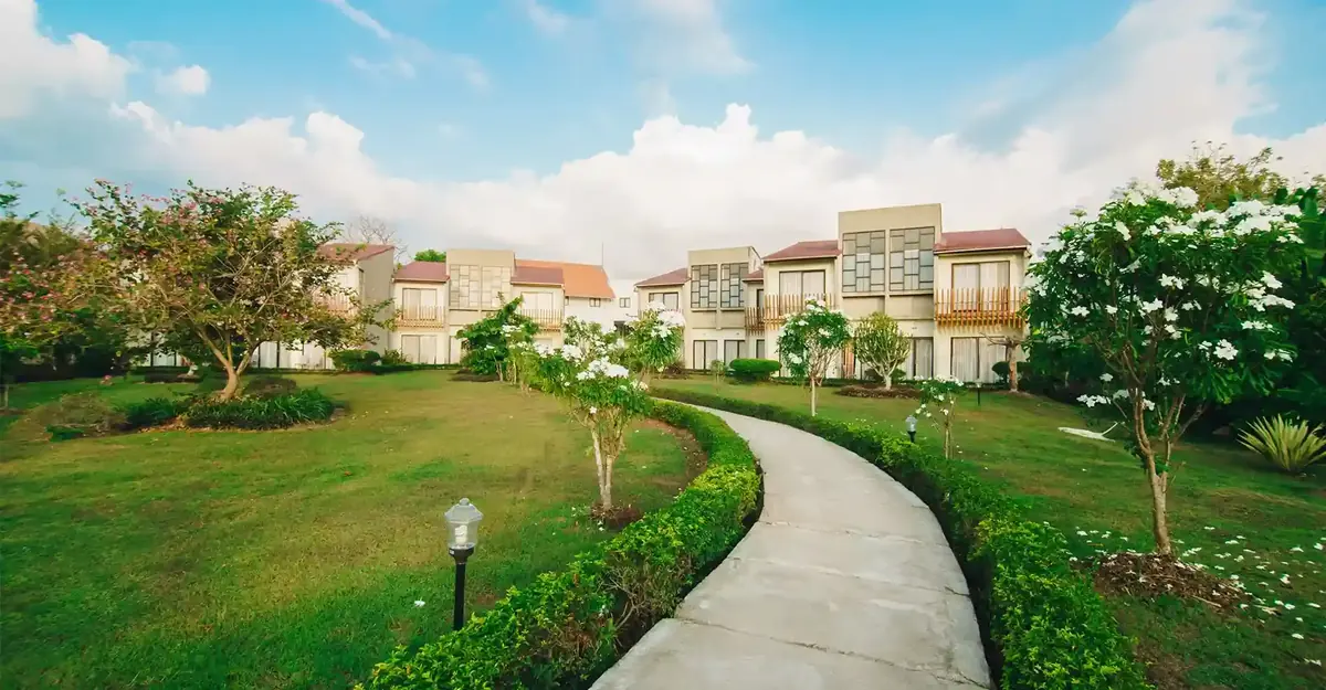 Garden path through a low-rise resort in the tropics