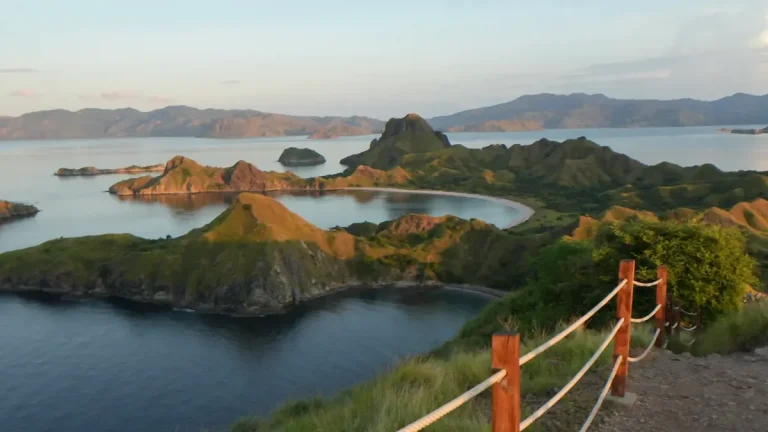 Green ridges above curved turquoise bays in Komodo National Park