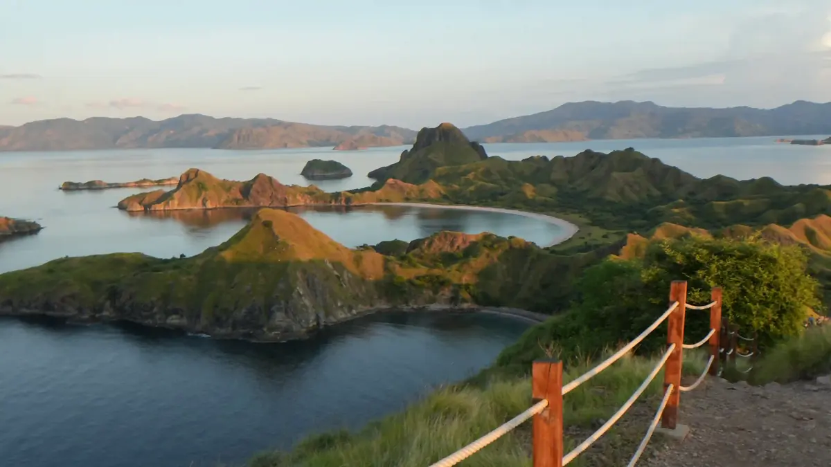 Green ridges above curved turquoise bays in Komodo National Park