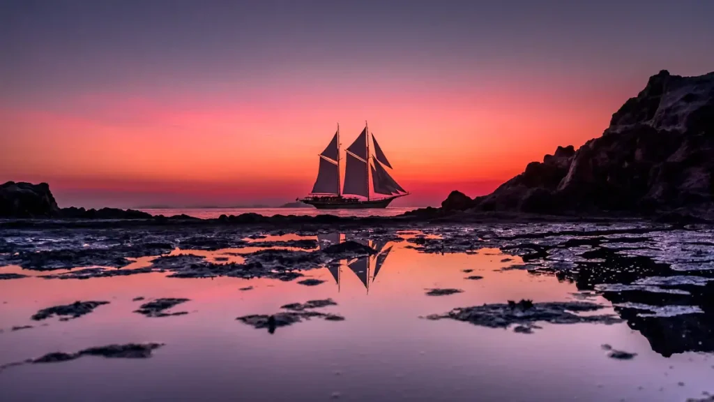 Sunset over the water seen from a boat at anchor